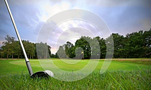 Chipping golf ball onto green photo