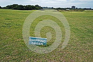 Chipping Green, text in a signboard over the grass on golf course, Rio photo
