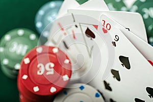 Chips with cards for poker game, closeup