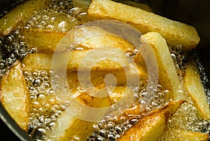 Chips cooking in Oil. photo