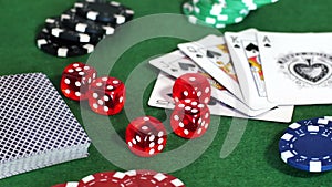 Chips, deck of cards and dice on table