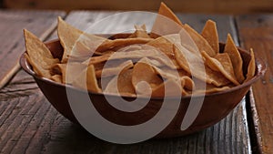 Chips and salsa in a table.