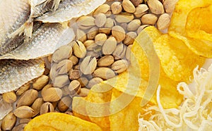 Chips, squids, pistachios and salty fish