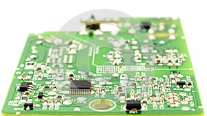 chipset and electronic component installed on green circuit board with white background