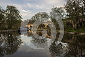 Chirk aqueduct and viaduct on the Llangollen canal, on the border of England and Wales. With a barge moored