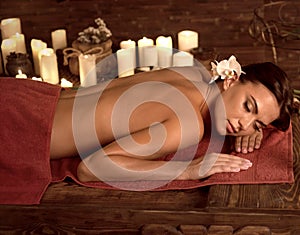 Chiropractic massage therapy of woman in spa salon.