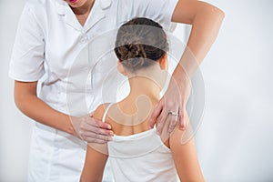 Chiropractor doing adjustment on female patient