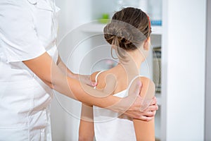 Chiropractor doing adjustment on female patient