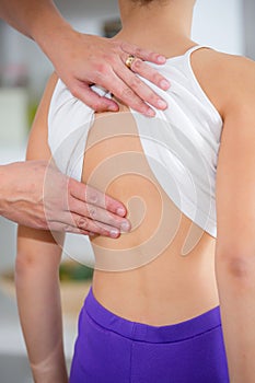 Chiropractor doing adjustment on female patient