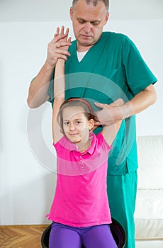 Chiropractor doing adjustment on female patient