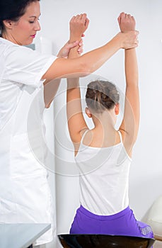Chiropractor doing adjustment on female patient
