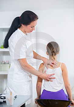 Chiropractor doing adjustment on female patient