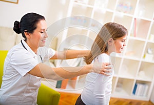 Chiropractor doing adjustment on female patient