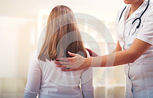 Chiropractor doing adjustment on female patient