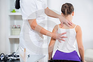 Chiropractor doing adjustment on female patient