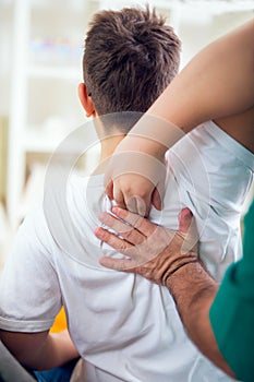 Chiropractor doing adjustment on patient