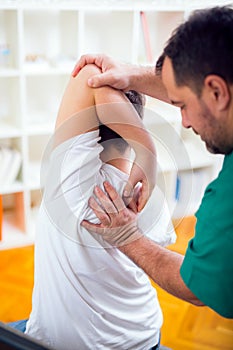 Chiropractor doing adjustment on patient