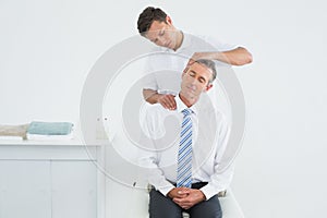 Chiropractor doing neck adjustment