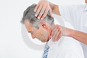 Chiropractor doing neck adjustment