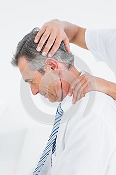 Chiropractor doing neck adjustment