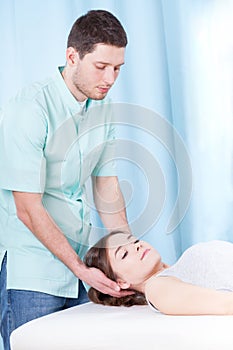 Chiropractor doing neck adjustments photo