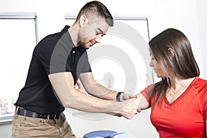 Chiropractor massage the female patient