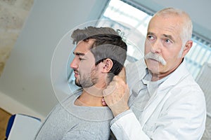 chiropractor with patient