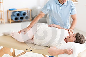 Chiropractor performing back adjustment