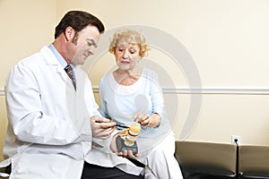 Chiropractor and Senior Woman