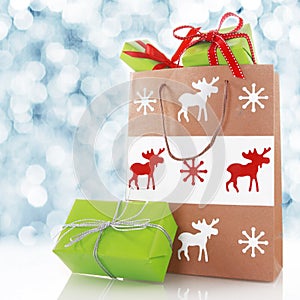 Chirstmas gifts in a decorated shopping bag