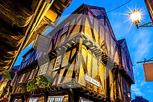 A Chirstmas night view of Shambles, a historic street in York featuring preserved medieval timber-framed buildings with jettied photo