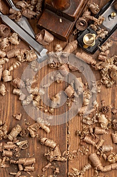 Chisel and small block plane with wood shavings