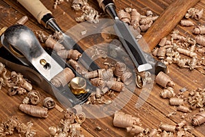 Chisel and small block plane with wood shavings