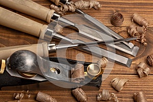 Chisel and small block plane with wood shavings