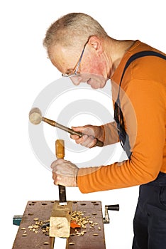 Chiseling and carving the wood