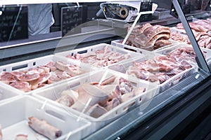 Chisinau, Moldova - January 23, 2022: Refrigerated display case with fresh meat in supermarket. Fresh meat in Metro Cash Carry.