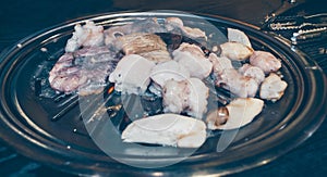 Chitterlings with mushrooms being fried at korean restaurant photo