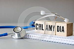 Chlamydia, Chlamydia Trachomatis, Conceptual word Chlamydia on wooden blocks, Health concept, Bacteria causing urinary tract