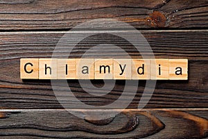 Chlamydia word written on wood block. chlamydia text on table, concept