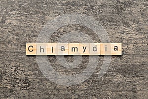 chlamydia word written on wood block. chlamydia text on table, concept