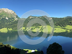 Chli Mutzenstein mountain above the Wagital valley Waegital or WÃ¤gital and alpine Lake Wagitalersee WÃ¤gitalersee, Innerthal