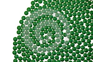 Chlorella algae green tablets isolated on white background.seaweed dietary supplements. Chlorella Powder Tablets