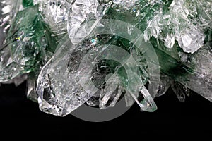 Chlorinated Quartz Crystals. Large crystals green and white; surrounded by clusters of smaller crystals.