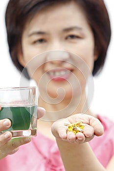 Chlorophyll drink and cod liver oil for middle aged health photo