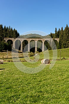 Chmarossky viaduct on the background of the forest, the old railway