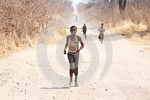 CHOBE, BOTSWANA - OCTOBER 5 2013: Poor African children wander t