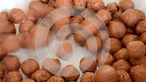 Choco balls cereal pouring into white background