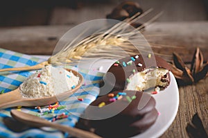 choco pie chocolate coated snacks on wooden background photo