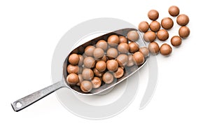 Chocolate balls in metal scoop