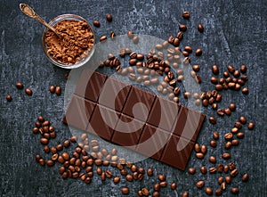 Chocolate bar, cocoa powder and fresh fried coffee beans